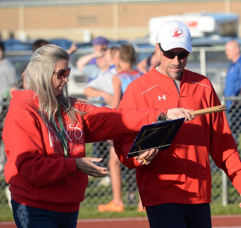 Organizing and overseeing the 1A Oregon boys track sectional on May 23, 2025 was one of the last activities for Oregon Athletic/Activities Director Mike Lawton (right) and administrative assistant Tracy Harvey. They both are retiring after this school year.