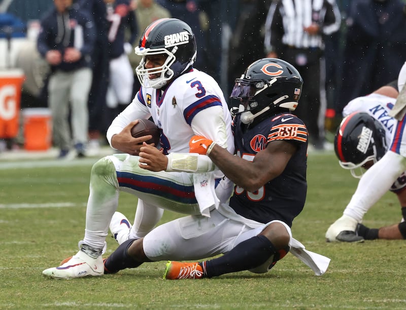 Chicago Bears safety C.J. Gardner-Johnson sacks New York Giants quarterback Russell Wilson for a sack Sunday, Nov. 9, 2025, during their game at Soldier Field in Chicago.