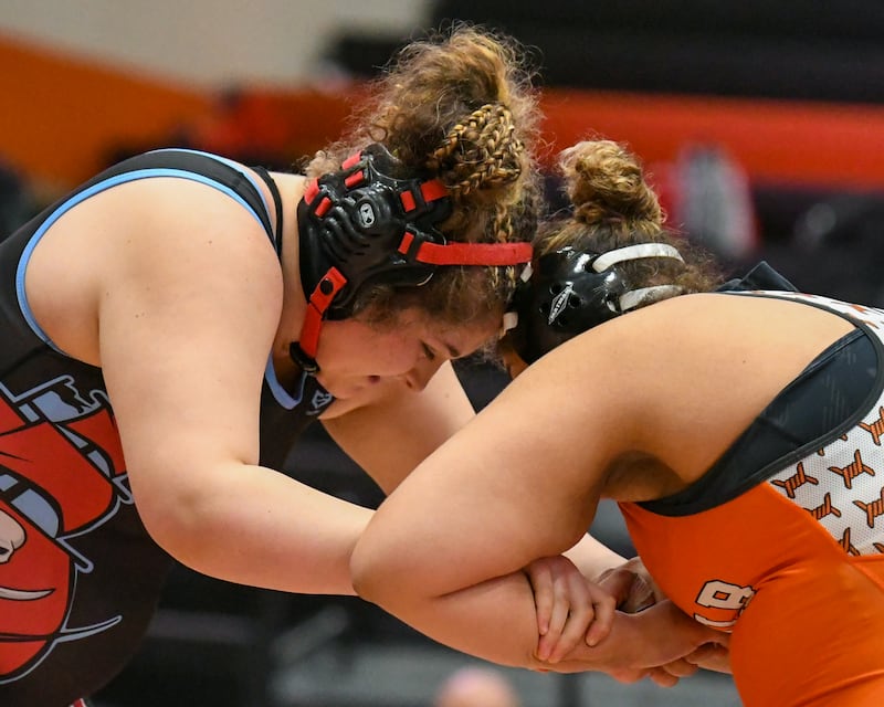 Ottawa Township wrestler’s Juliana Thrush, left, goes head-to-head with Aarianna Bloyd of DeKalb during the 235-pound weight class championship match up on Saturday Feb. 14, 2026, held at DeKalb High School.