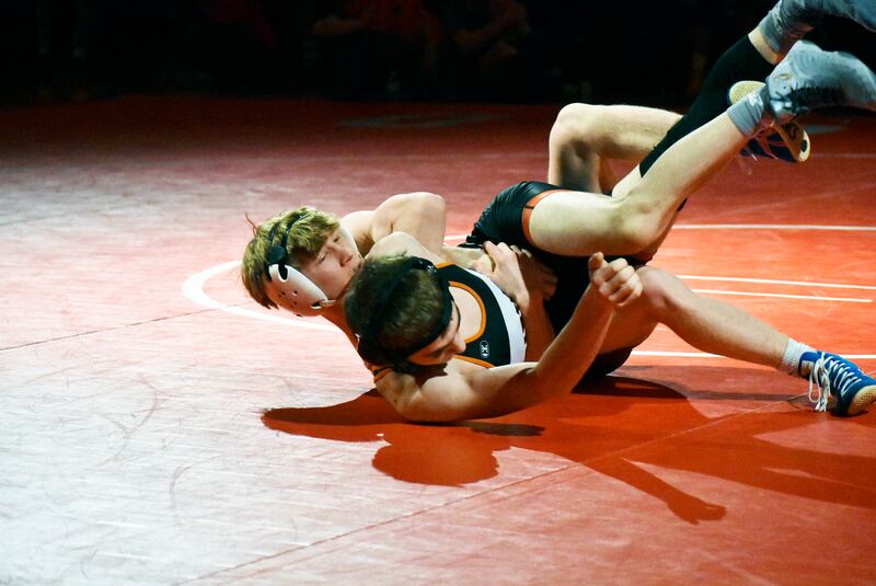Marian Central’s Brayden Teunissen controls Sandwich’s Jakob Gruca during the IHSA Class 1A Dual Sectional at Oregon on Tuesday, Feb. 25, 2025 in Oregon.