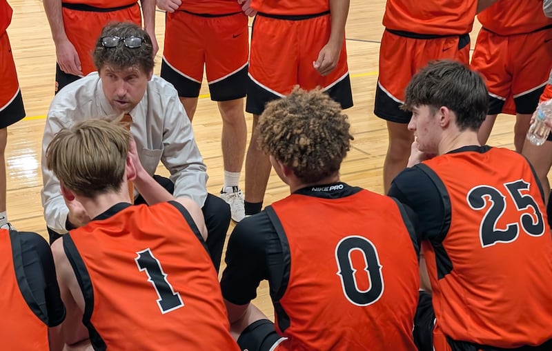 Crystal Lake Central boys basketball coach Brian Seaver talks to his team during a timeout against Harvard on Thursday, Dec. 18, 2025, at Harvard High School.