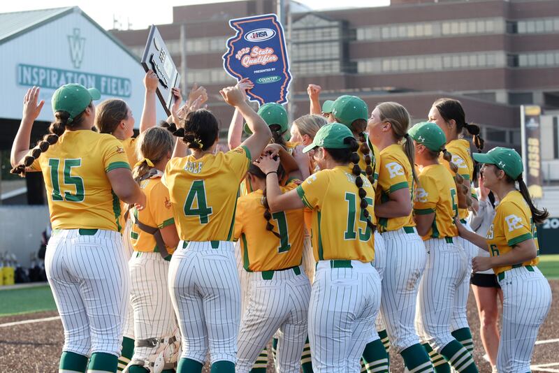 The Providence softball team celebrates its trip to state after a 5-4 win in nine innings over Pontiac in the Class 3A Illinois Wesleyan Supersectional Monday, June 9, 2025.