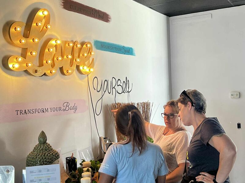 Amber Hoffman, owner of Elevate Studio, assists clients at her fitness center located at 325 First Ave. in Sterling, on Aug. 1, 2025.