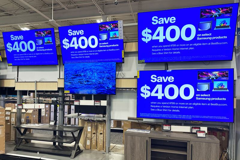 Flat screen TVs are displayed at a retail store in Vernon Hills, Ill., Thursday, Aug. 7, 2025. (AP Photo/Nam Y. Huh)