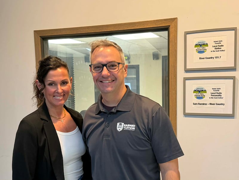 Sauk Valley Community College's Sarah Partington and Jim Grot stand outside the booth at the WIXN radio station in Dixon.