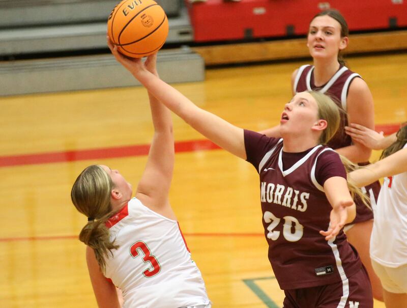 Morris's Landrie Callahan grabs a rebound over L-P's Emma Jereb on Friday, Dec. 6, 2024 in Sellett Gymnasium at L-P High School.
