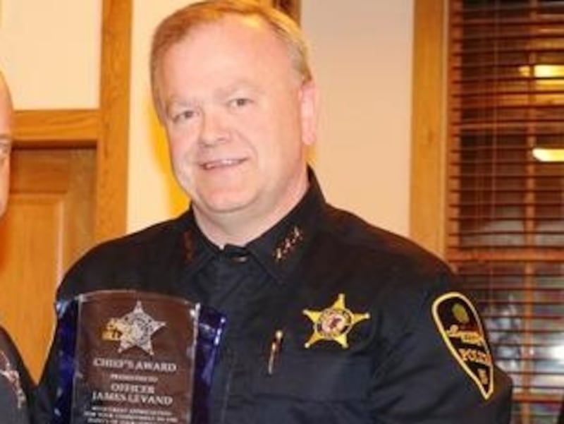 Campton Hills Police Chief Steve Millar, right, presents Campton Hills police officer James Levand, left, with the Officer of the Year award. Levand was a driving force in developing the village's first K-9 program as well as leading a fundraising campaign for the program that resulted in the department acquiring and outfitting Koda.