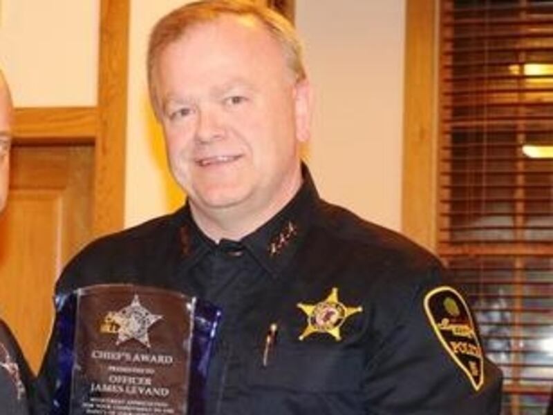 Campton Hills Police Chief Steve Millar, right, presents Campton Hills police officer James Levand, left, with the Officer of the Year award. Levand was a driving force in developing the village's first K-9 program as well as leading a fundraising campaign for the program that resulted in the department acquiring and outfitting Koda.