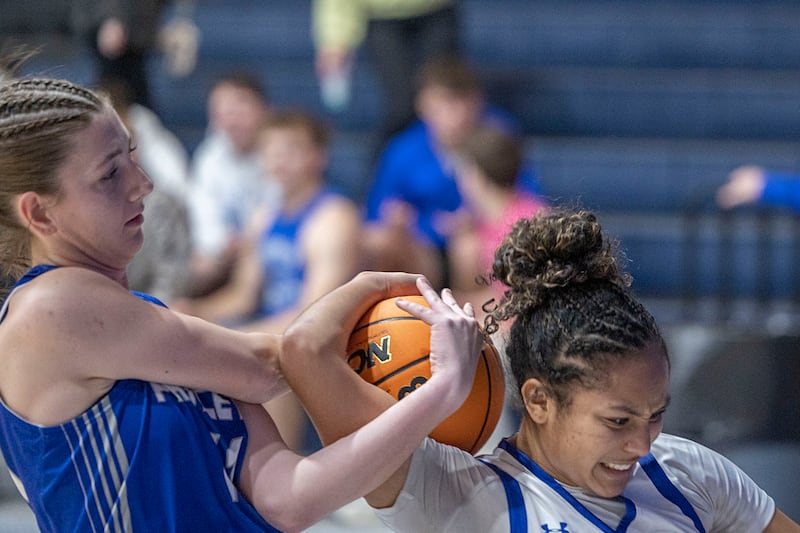 Newman’s Gisselle Martin and Princeton’s Madie Gibson work for the ball Thursday, Jan. 15, 2026.