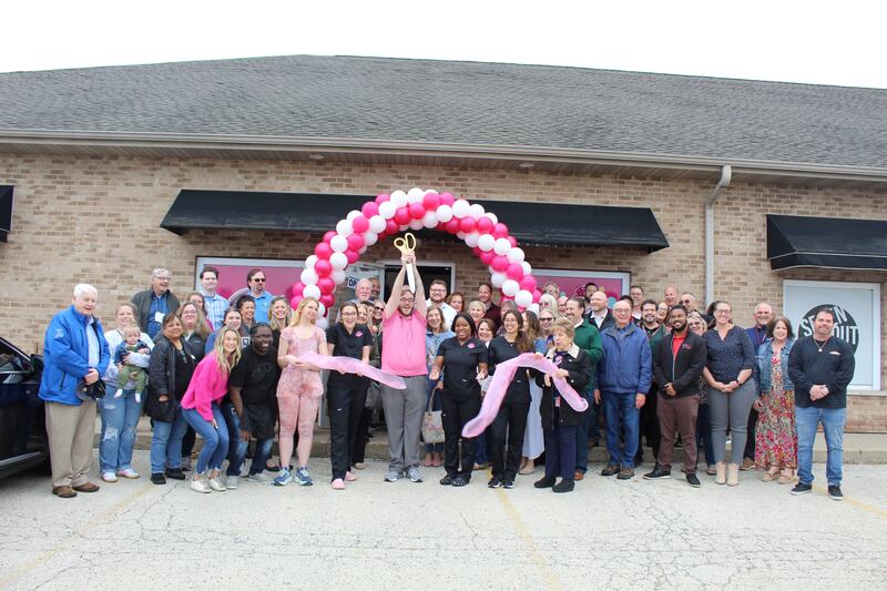 The DeKalb and Sycamore chambers of commerce celebrating Smallcakes Cupcakery and Creamery's opening
