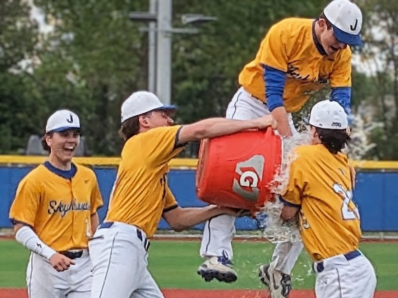 Johnsburg's baseball players celebrate on the mound after beating Plano 9-2 to clinch the Kishwaukee River Conference championship Monday, May 18, 2026, in Johnsburg.