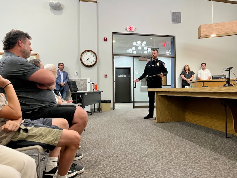 Dixon's new chief of police Ryan Bivins (middle left) talks about his plans for the future of the department after being sworn in at Monday's Dixon City Council meeting, June 2, 2025.