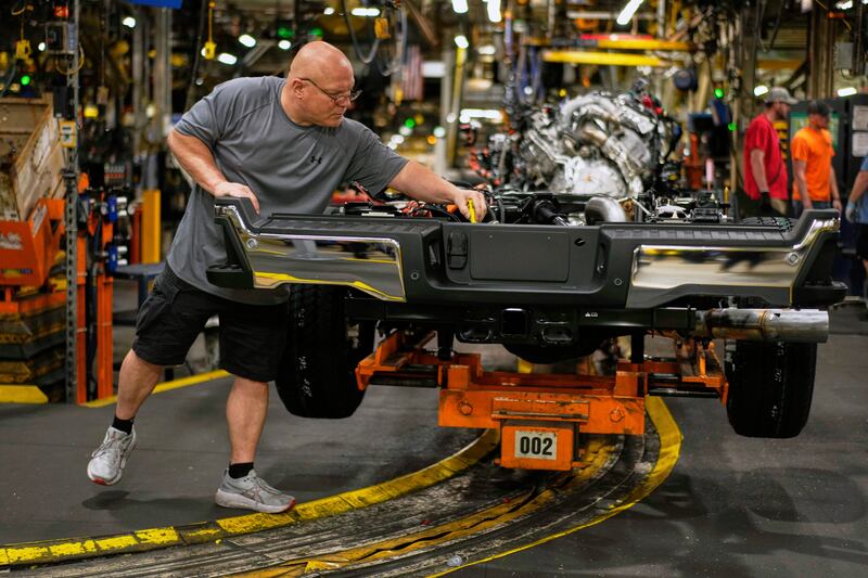 FILE - Vehicle assembly technician Kevin Zepernick works on a 2025 Ford Expedition during a media tour to launch the 2025 Ford Expedition at the Ford Motor Company Kentucky Truck Plant, Wednesday, April 30, 2025, in Louisville, Ky. (AP Photo/Carolyn Kaster, File)