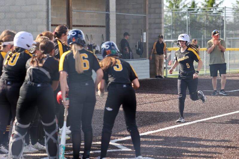 Herscher's Kiera Ahramovich is welcomed at home plate by her team after a home run during the Tigers' 13-6 victory against Central on Wednesday, May 14, 2025.