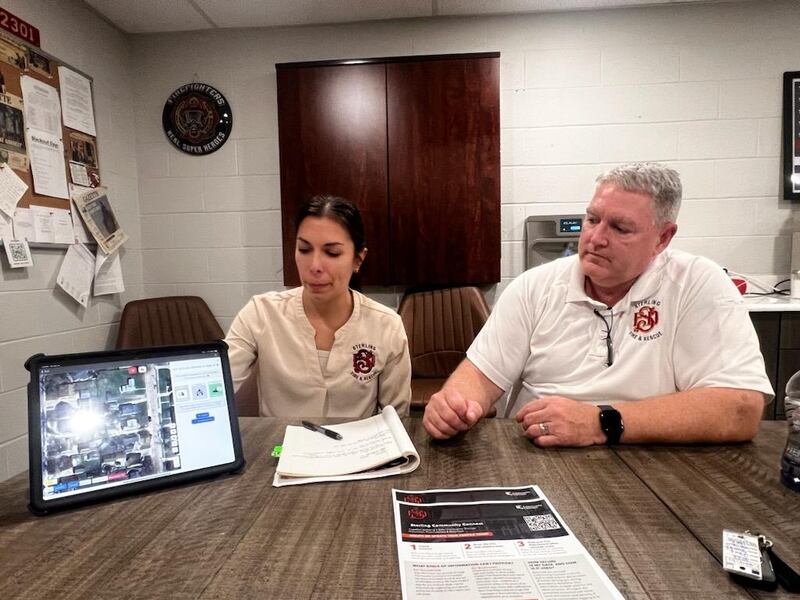 Sterling Fire Department Administrative Assistant Angelica Dornes (left) and Sterling Deputy Fire Chef David Northcutt display the new Sterling Communications software Friday, Oct. 11, 2024, in Sterling.