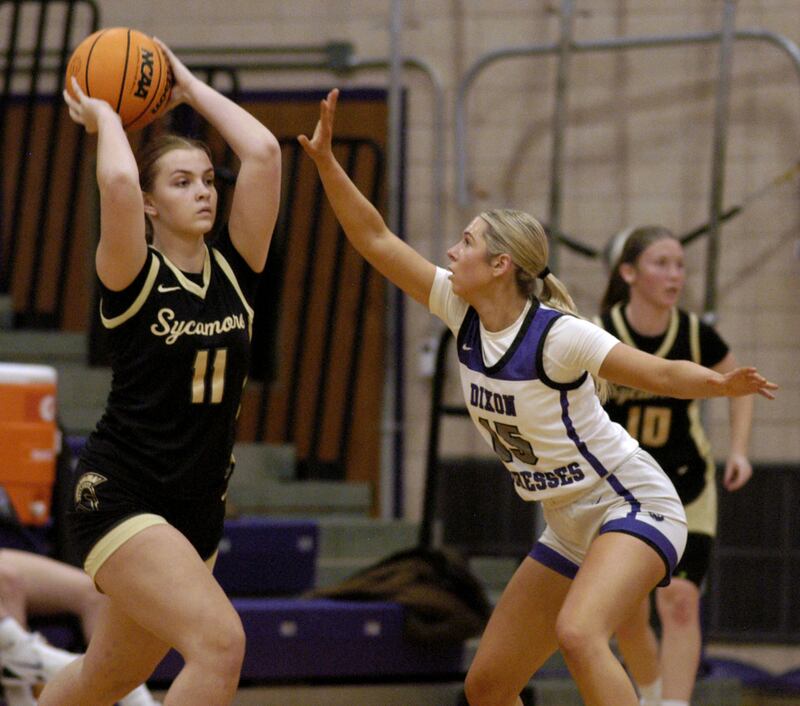 Dixon's Morgan Hargrave defends against Sycamore's Macy Calendo during their game Saturday, Dec. 20, 2025 at Lancaster Gym in Dixon.