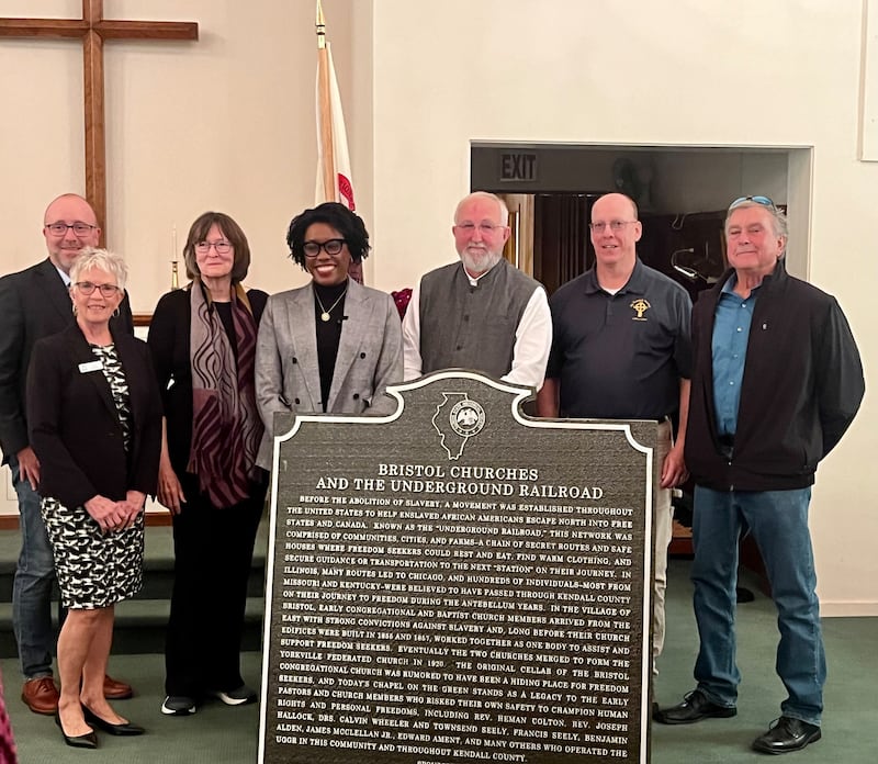 Speakers at the Oct. 24, 2025, unveiling of the Chapel on the Green in Yorkville's new historical marker for its participation in the Underground Railroad. Pictured, State Rep. Jed Davis, R- Yorkville, President of the Chapel Susan Kritzberg, descendant of abolitionist Holy Wheeler Brady and U.S. Rep. Lauren Underwood, D- Naperville. Also pictured, executive director of the Illinois Historical Society Bill Furry, Yorkville mayor John Purcell, and chairman of the Kendall County Historic Preservation Commission Jeff Wehrli.