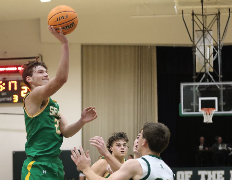 Seneca's Brady Sheedy lets go of a shot over St. Bede's AJ Hermes on Tuesday, Dec. 16, 2025 at St. Bede Academy.