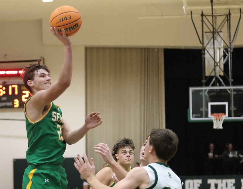 Seneca's Brady Sheedy lets go of a shot over St. Bede's AJ Hermes on Tuesday, Dec. 16, 2025 at St. Bede Academy.