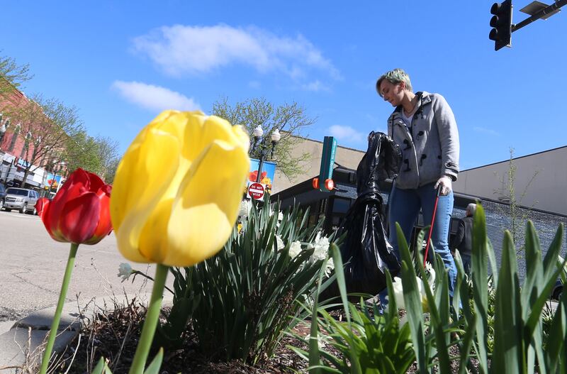 Shelby Williams, of Ottawa, cleans up trash during Operation Clean Sweep on Saturday, April 26, 2025 downtown Ottawa. In honor of Earth Day this week, the Ottawa Downtown Association asked community members to participate in the cleanup. Volunteers helped clean litter throughout downtown Ottawa beginning in the Jordan block.