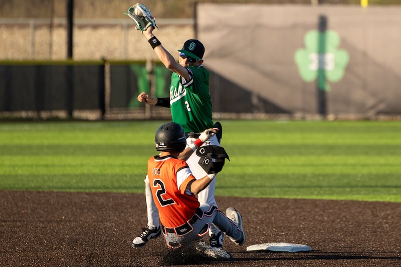Keegan Murphy (2) of Seneca loses ball whilst Nicholas Fox (2) of Beecher slides into second base on Friday, April 11, 2025 at Seneca High School in Seneca.