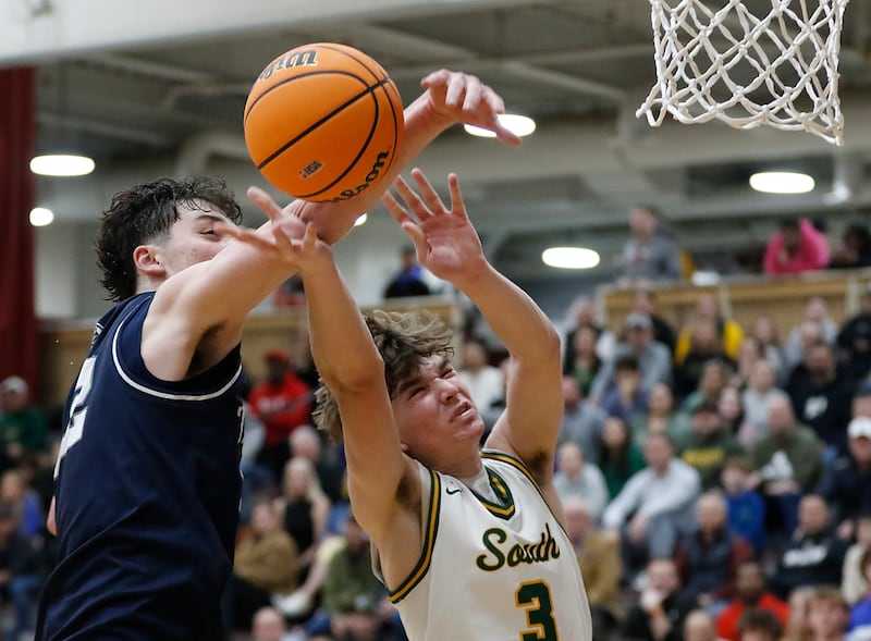 Cary-Grove's Adam Bauer knocks the ball away from Crystal Lake South's Nick Stowasser during the IHSA Class 3A Prairie Ridge Regional championship basketball game on Friday, Feb. 28, 2025, at Prairie Ridge High School in Crystal Lake.