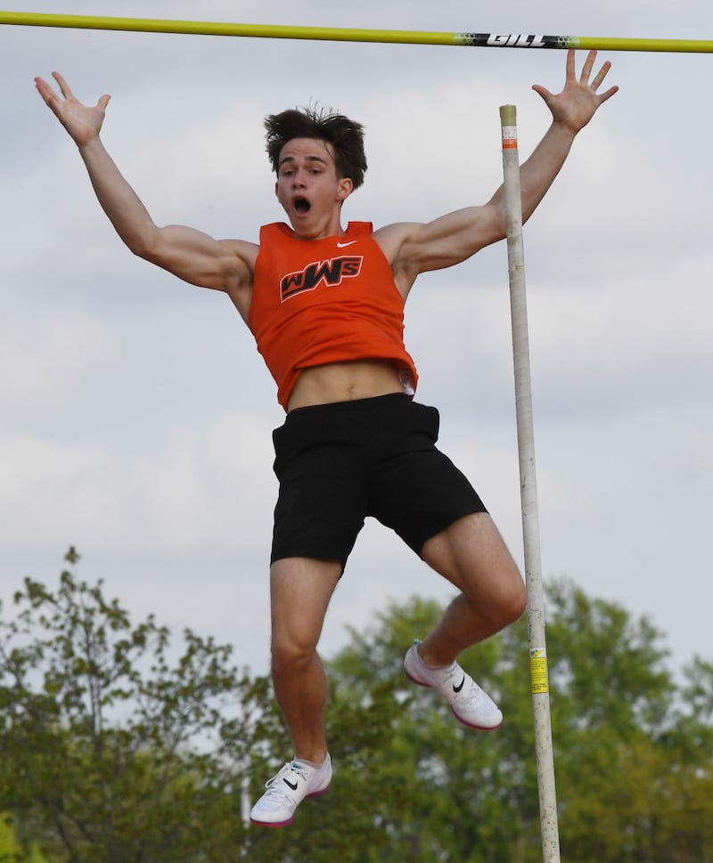 Wheaton Warrenville South’s Josh Clevenger celebrates as he makes the winning jump in pole vault during the Red Grange boys track and field meet at Wheaton Warrenville South High School on Friday, April 24, 2026 in Wheaton.