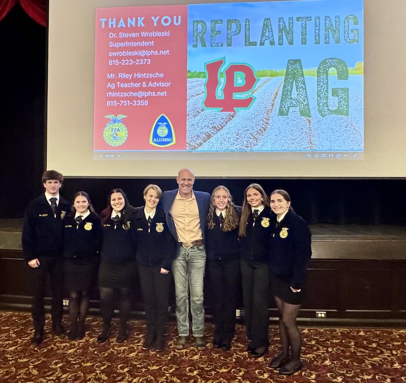 Riley Hintzsche, Head of the L-P Agriculture Department, stands with a few of his students during the Monday, Nov. 17, 2025, "Replanting Agriculture" meeting.