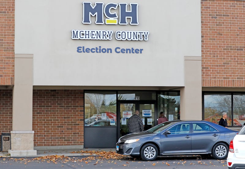 People enter and leave the  the McHenry County Election Center on Thursday Oct, 31, 2024, in Woodstock.