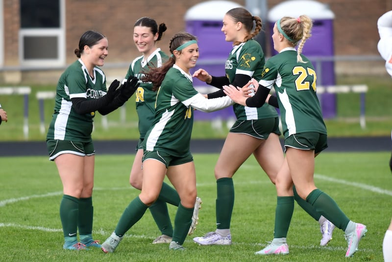 Coal City's Hayden Francisco, center, is congratulated by her Coaler teammates after her first of two goals in the Coalers' 4-0 win over Beecher in the IHSA Class 1A Manteno Regional championship Tuesday, May 20, 2025.