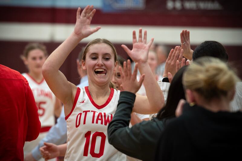 Ottawa's Ella Schmitz celebrates with teammates after defeating Kankakee 36-33 in overtime in the IHSA Class 3A Kankakee Regional championship Thursday, Feb. 20, 2025.