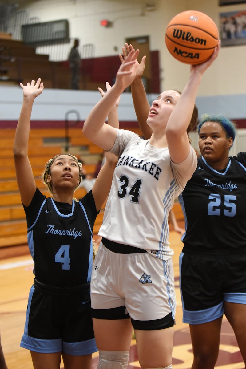 Kankakee's Ava Johnson, center, takes a shot in front Thornridge's Annastasia Lane, left, and Lena Allen during a game at Kankakee Thursday, Jan. 8, 2026.
