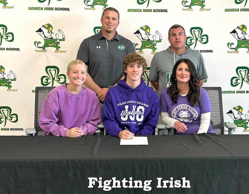 Seneca's Travis Barr has signed on to continue his education at Joliet Junior College and his track career at the NJCAA Division III level with the Wolves. He is pictured here sitting between Aubree Barr (left) and Nicole Olson (right), with Seneca High School's Terry Maxwell and Ted O'Boyle standing behind.