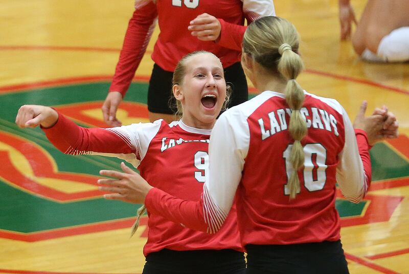 L-P's Aubrey Urbanski reacts with teammate Kelsey Frederick after defeating Princeton on Tuesday, Aug. 26, 2025 in AJ Sellett Gymnasium at L-P High School.