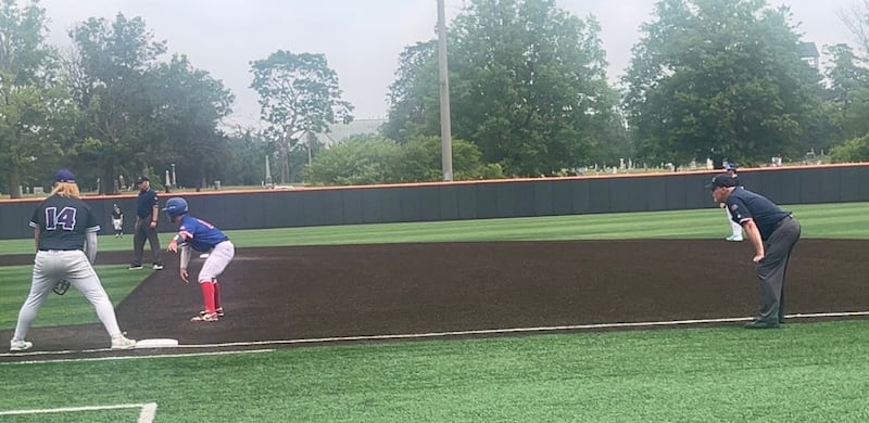 Grand Ridge's Jim Heth umpires at first base in the Class 1A state baseball third-place game between Lexington and Pawnee on Saturday at Illinois Field in Champaign.
