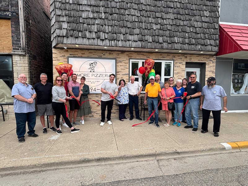 Ladd officials welcome Amore Pizzeria to town.