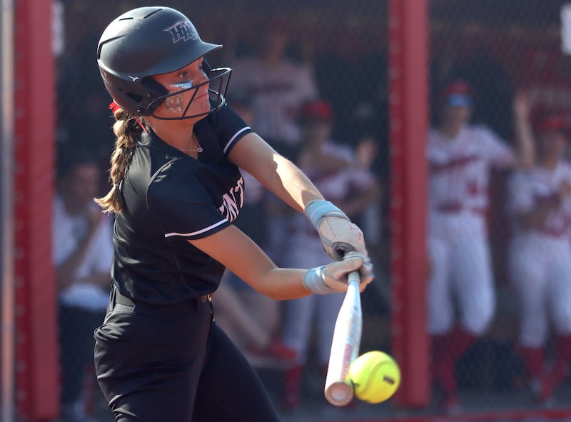 Huntley’s Grace Benson connects against Barrington for a single  in IHSA Class 4A Sectional Title Game softball action at the Fields of Dreams on the campus of Barrington High School in Barrington on Friday, June 6, 2025.