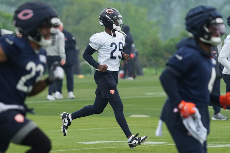 Chicago Bears defensive back Tyrique Stevenson (29) warms up with teammates during NFL football practice at Halas Hall in Lake Forest, Ill., Wednesday, June 4, 2025. (AP Photo/Nam Y. Huh)