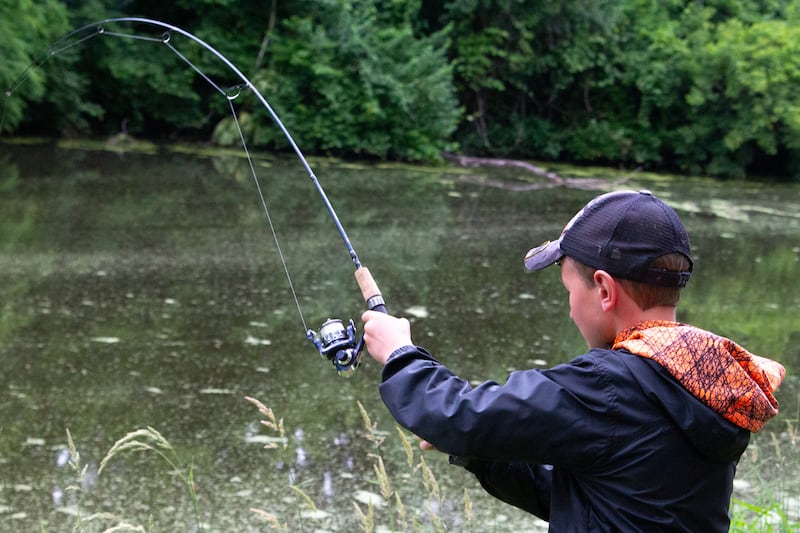 Kash Kiper reels in fish on Saturday, June 1, 2024, at the 37th annual Kid's Fishing Tournament at Illinois and Michigan Canal Lock 14 in La Salle.