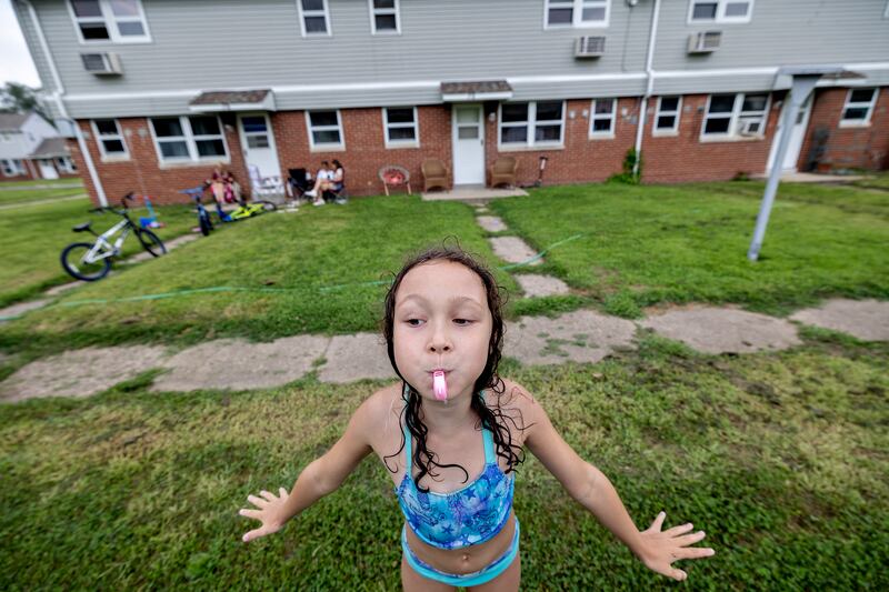 Aniyah Howards, 8, blows her whistle Friday, Aug. 1, 2025, in Rock Falls during a day of fun at the Coloma Township Homes in Rock Falls.