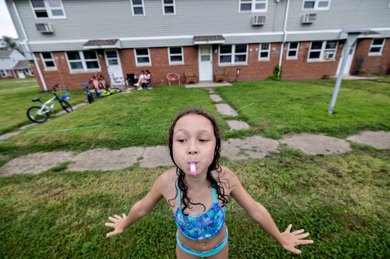 Aniyah Howards, 8, blows her whistle Friday, Aug. 1, 2025, in Rock Falls during a day of fun at the Coloma Township Homes in Rock Falls.