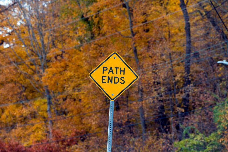 A sign marks the end of the east end of the Dixon multi-use path Thursday, Nov. 6, 2025, on River Road. Construction on an additional section of path leading to Raynor is in the works.