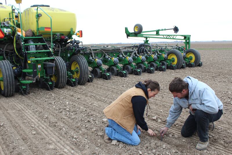 William and Lea Henert check the seed placement on their farm near Ashton, Illinois, where they grow corn, soybeans and seed corn for Wyffels Hybrids. William says this is the best ground conditions for planting he has experienced in the last decade.