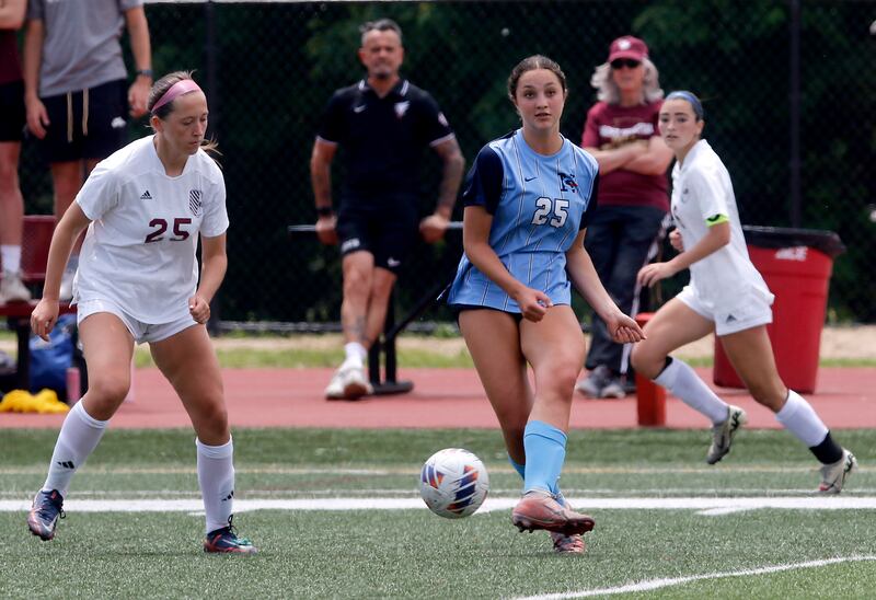 Nazareth Academy's Samantha Austin passes the ball as St. Ignatius College Prep's Maggie Helms Lakes'John Zutkis defends during a IHSA Class 2A State Girls Soccer semifinal match on Friday, June 6, 2025, at North Central College in Naperville.