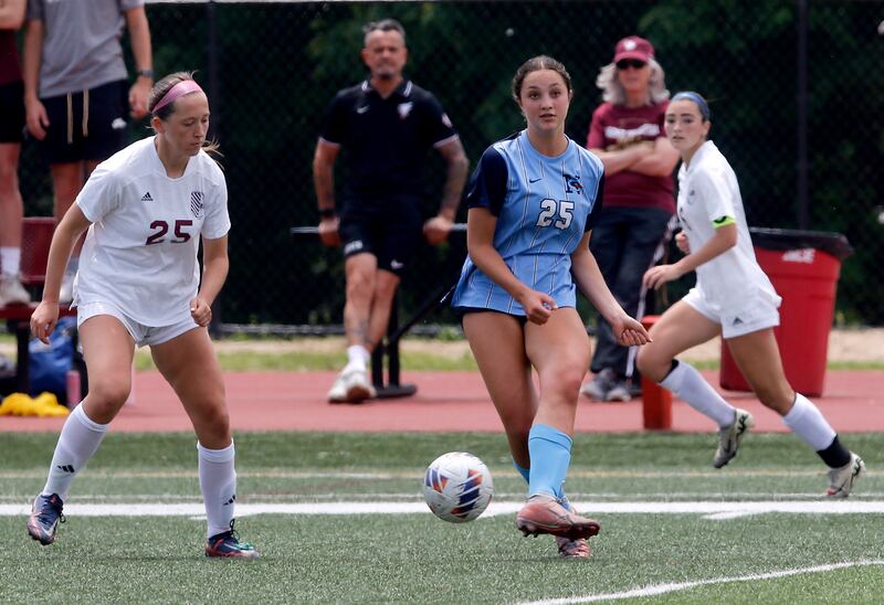 Nazareth Academy's Samantha Austin passes the ball as St. Ignatius College Prep's Maggie Helms Lakes'John Zutkis defends during a IHSA Class 2A State Girls Soccer semifinal match on Friday, June 6, 2025, at North Central College in Naperville.