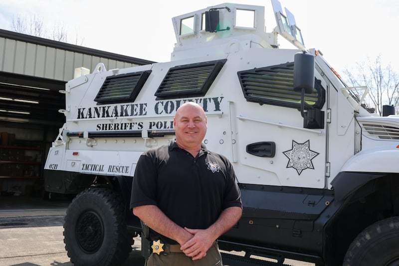 Kankakee County Sheriff's Lt. Russell Belcher, a Manteno native and 23-year member of the department, stands with Emergency Response Team's tactical rescue vehicle.