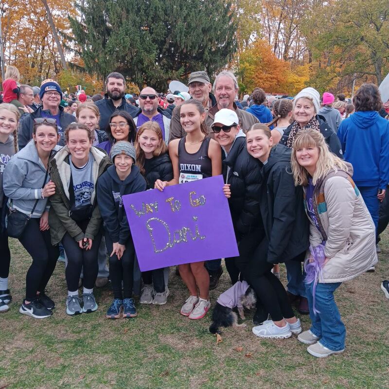 Dixon's Daniela Lovett, center, is pictured after her finish at the state cross country meet on Saturday, Nov., 8 in Peoria. She placed 19th.