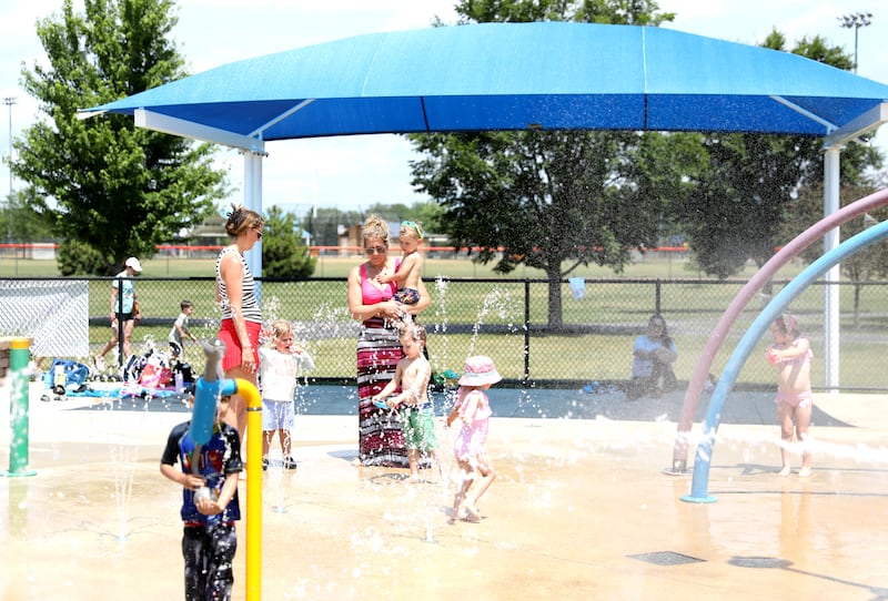 Kids and their parents stay cool at the Oswegoland Park District's Prairie Point Splash Pad on Wednesday, June 25, 2025 in Oswego.