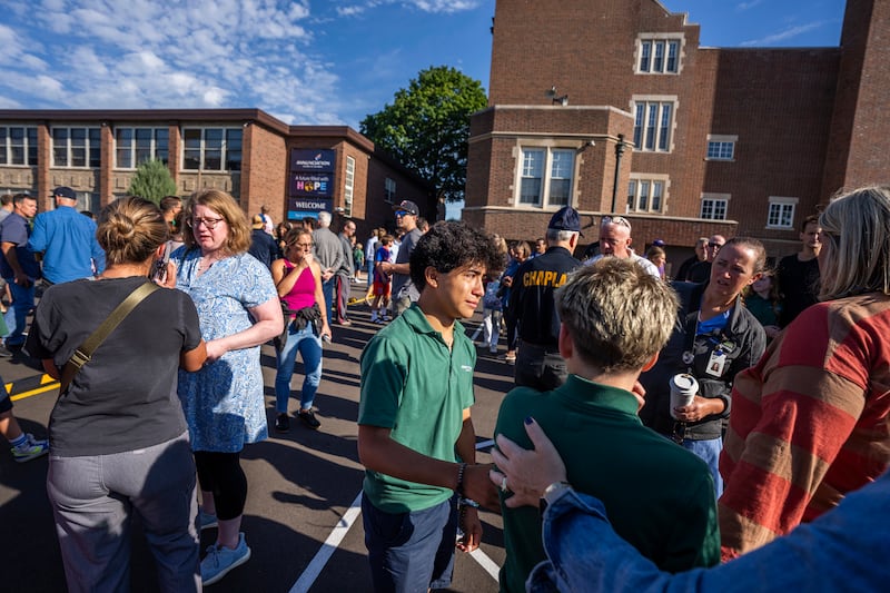 Students and parents await news during a mass shooting at the Annunciation Catholic School in Minneapolis on Wednesday, Aug. 27, 2025. (Richard Tsong-Taatarii/Star Tribune via AP)