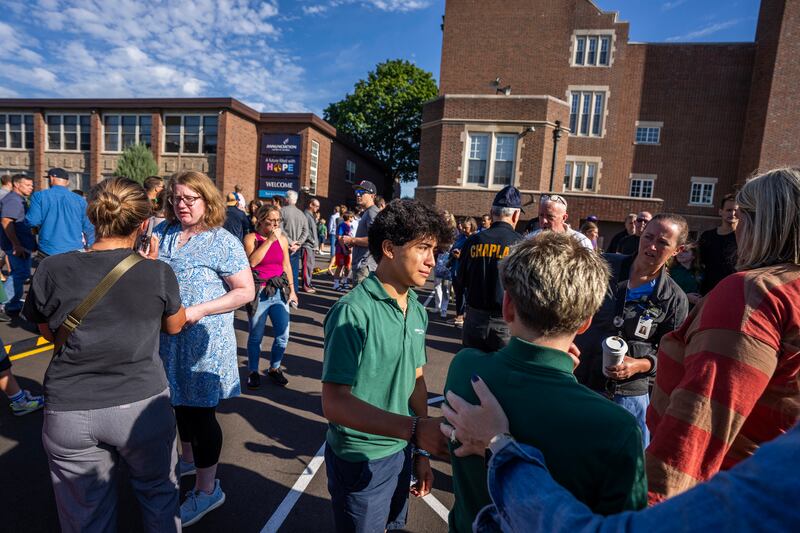 Students and parents await news during a mass shooting at the Annunciation Catholic School in Minneapolis on Wednesday, Aug. 27, 2025. (Richard Tsong-Taatarii/Star Tribune via AP)